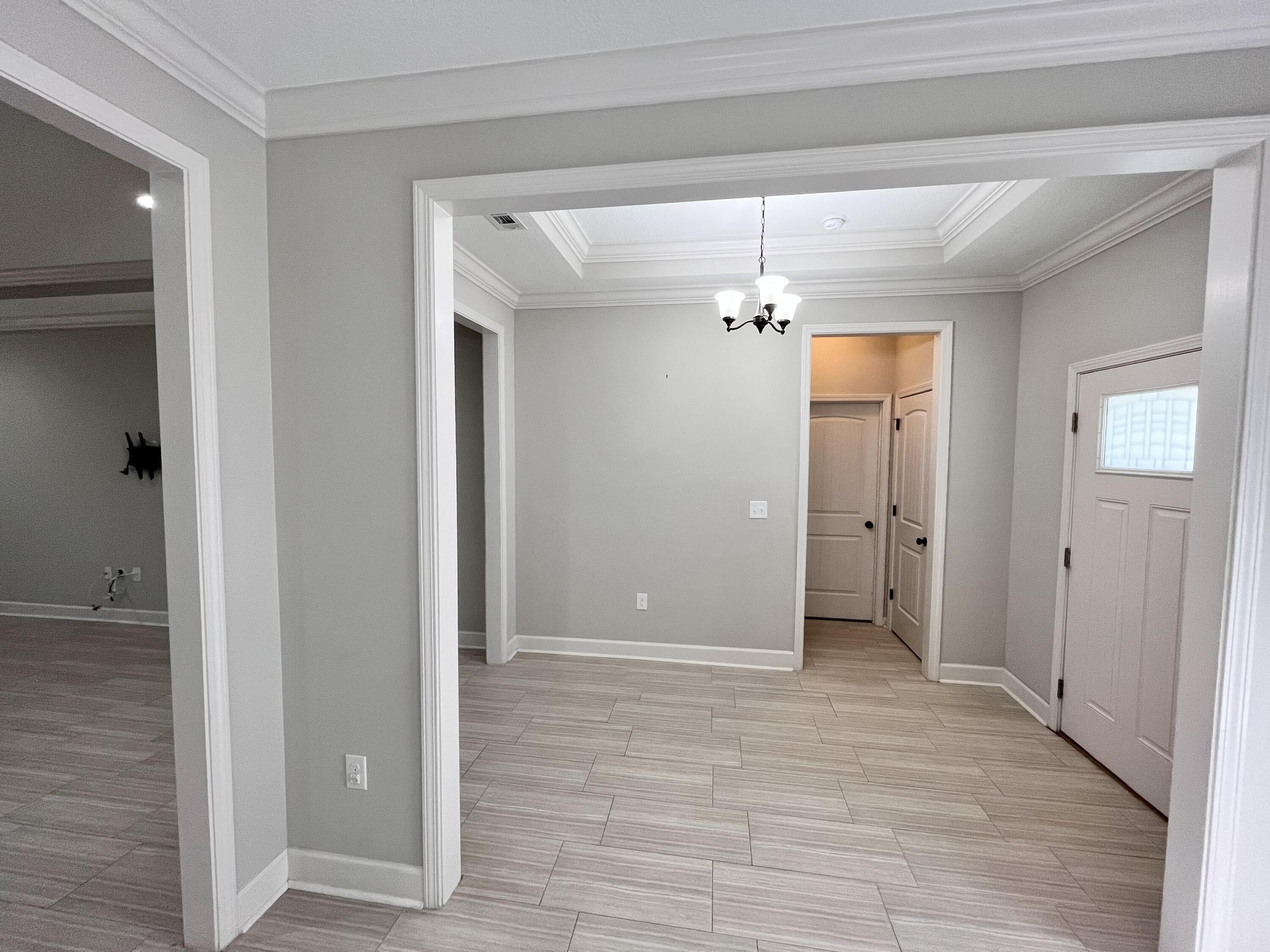 5182 Rabbit Run Crestview, FL 32539 - Photo 3 of 35 a view of a hallway with wooden shelves