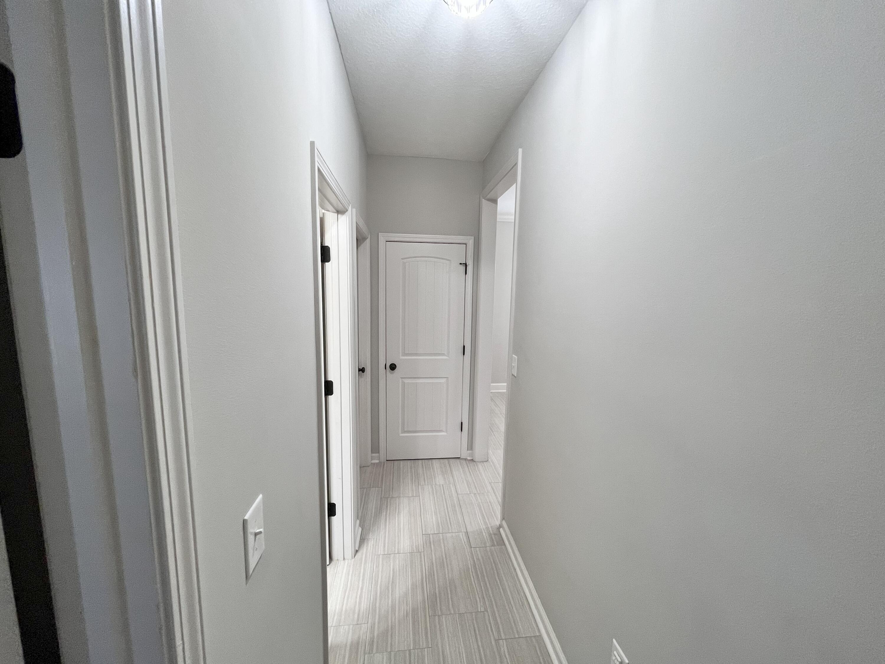 5182 Rabbit Run Crestview, FL 32539 - Photo 32 of 35 a view of a hallway with wooden floor