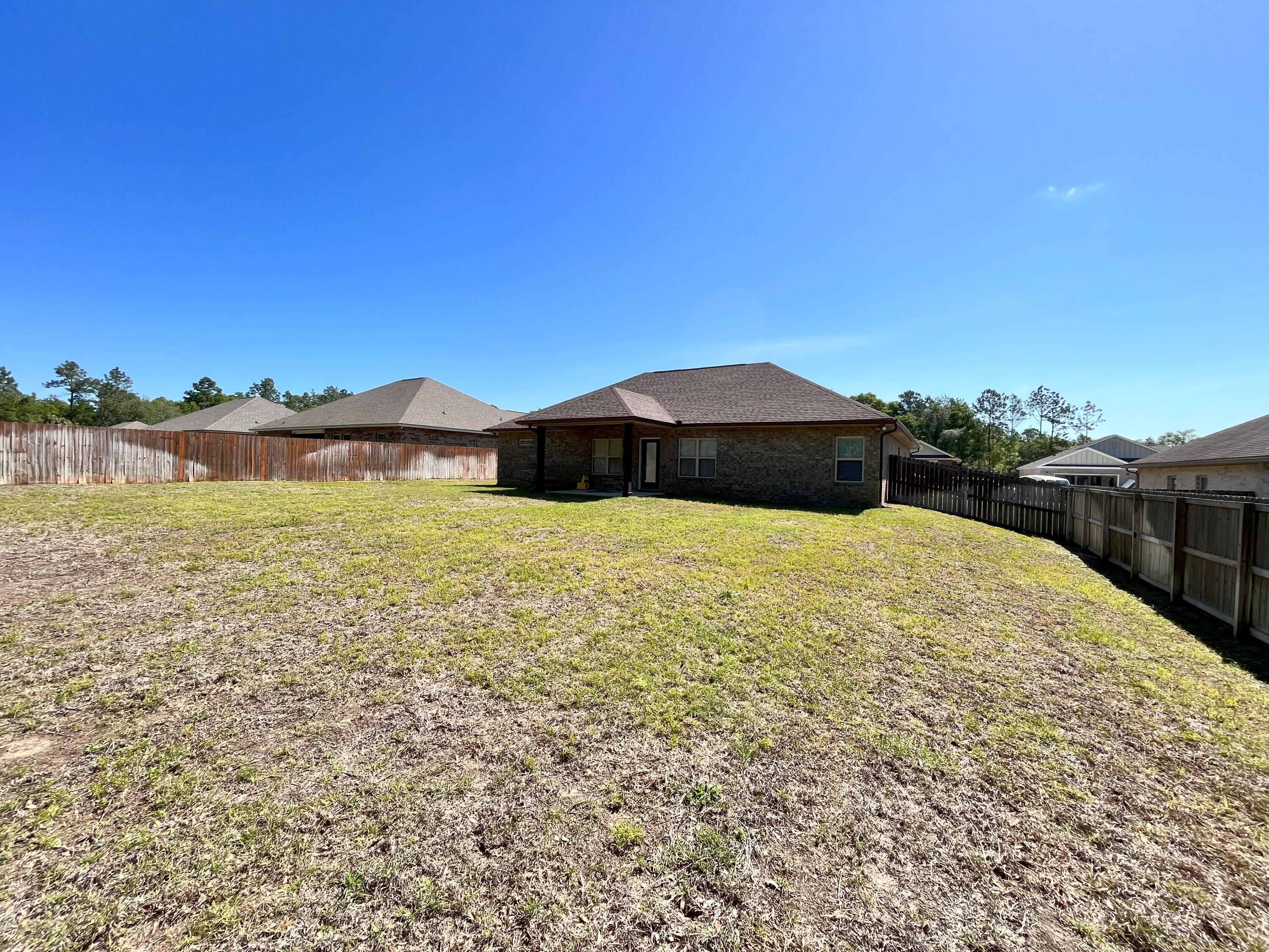 5182 Rabbit Run Crestview, FL 32539 - Photo 35 of 35 a view of a lake with a mountain in the background