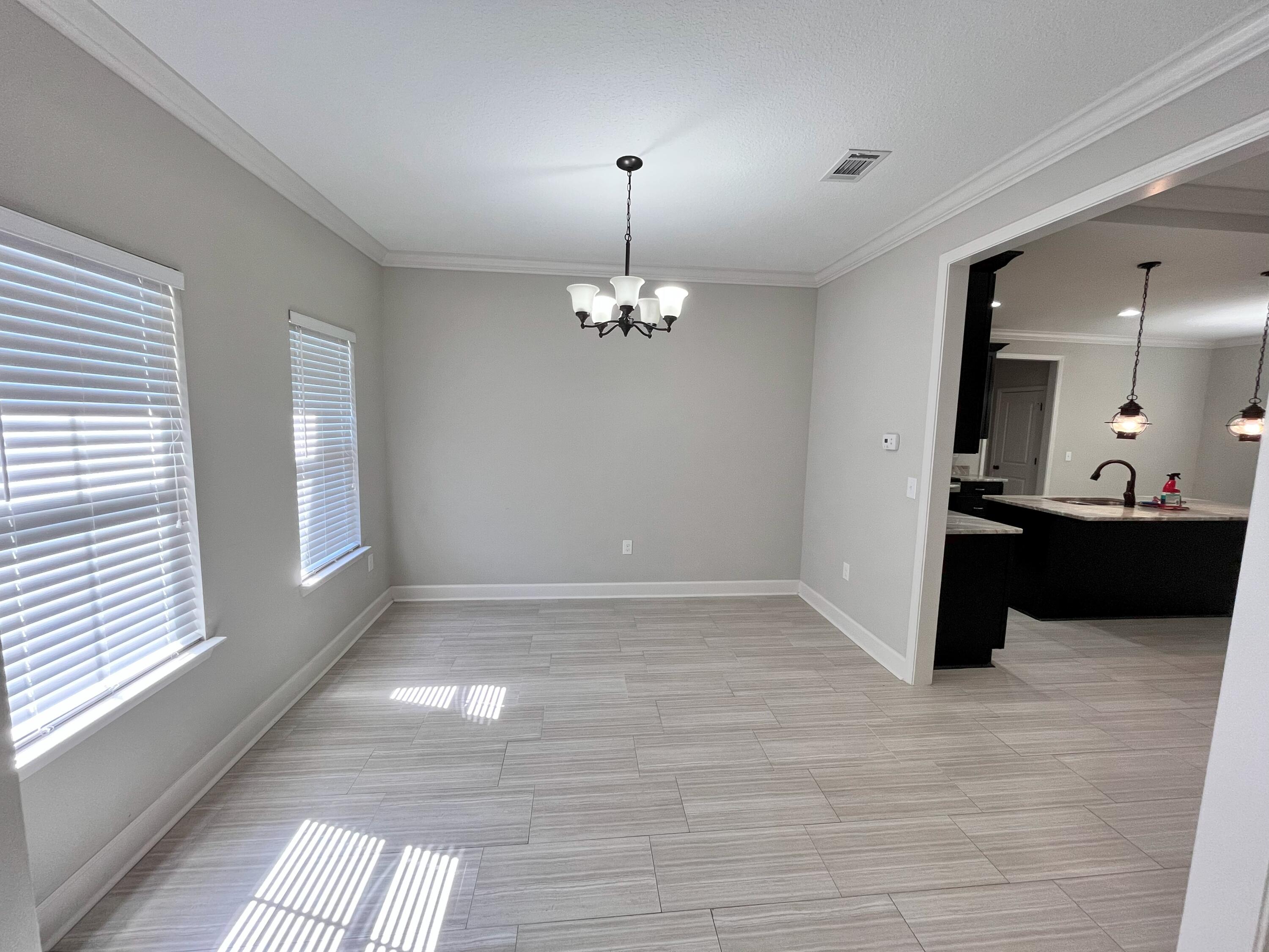 5182 Rabbit Run Crestview, FL 32539 - Photo 4 of 35 a view of a living room with a large window