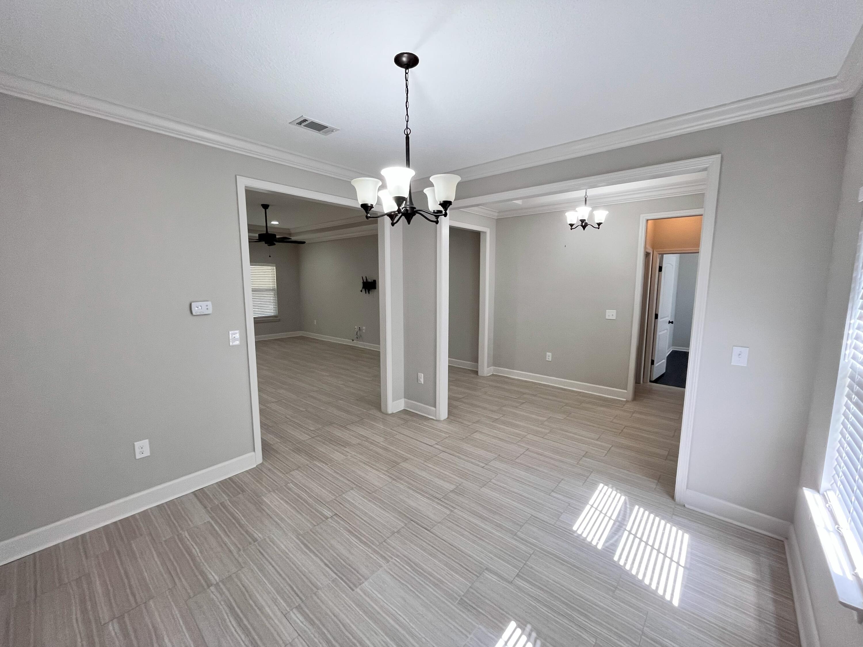5182 Rabbit Run Crestview, FL 32539 - Photo 5 of 35 a view of a room with wooden floor and staircase