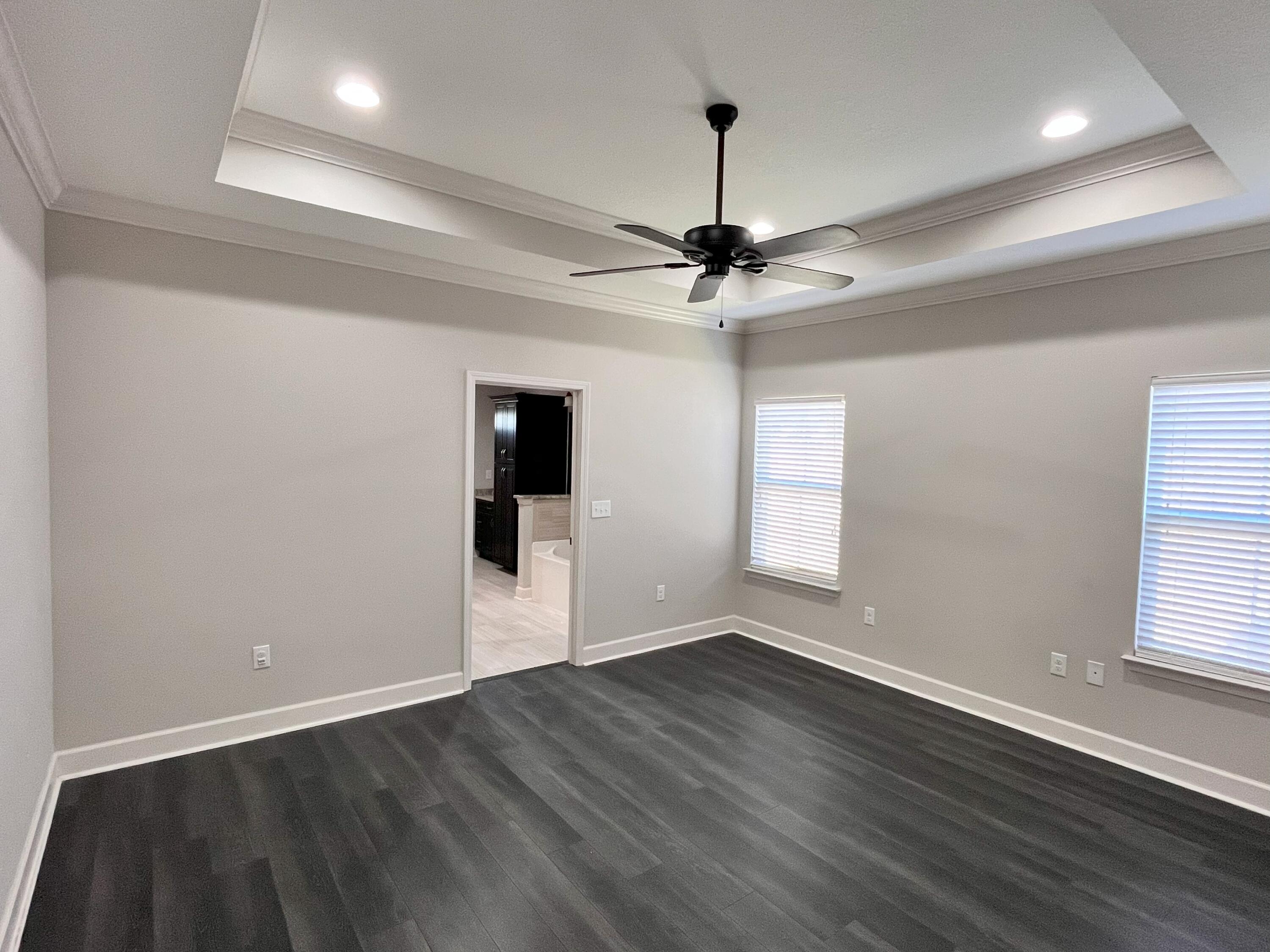 5182 Rabbit Run Crestview, FL 32539 - Photo 10 of 35 a view of an empty room with wooden floor and a window