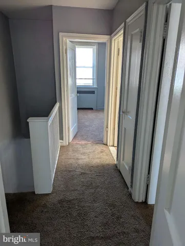 a view of a hallway with windows