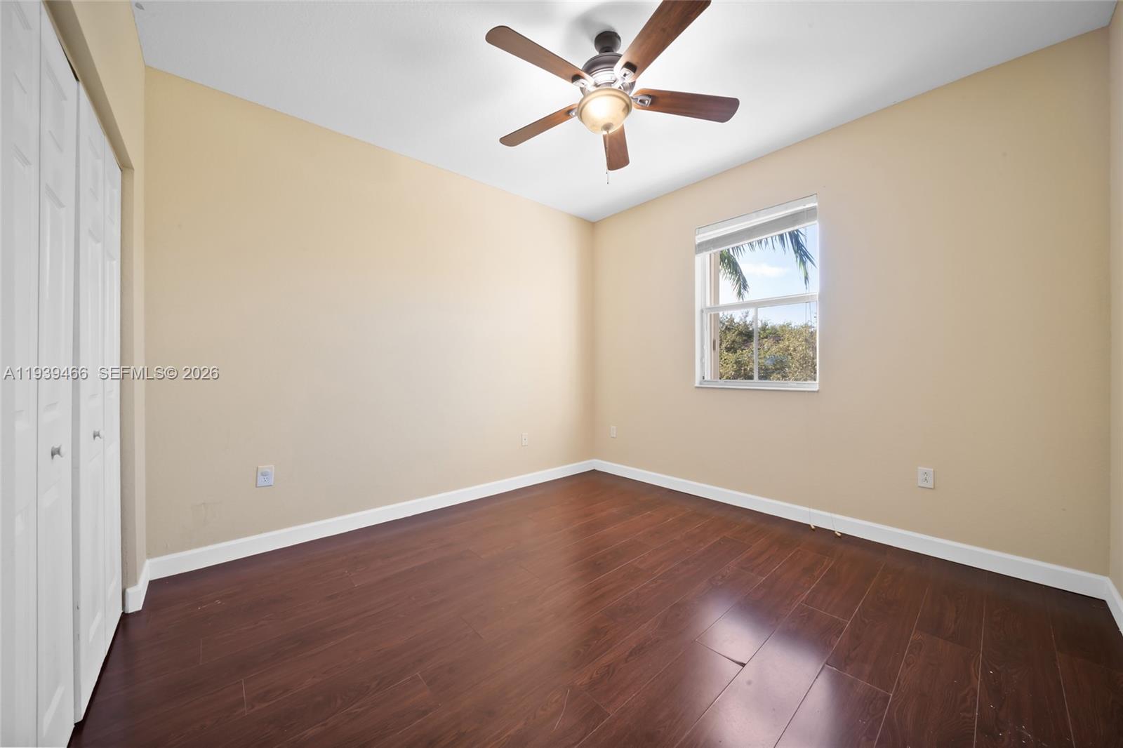 3641 Northeast 4th Street Homestead, FL 33033 - Photo 12 of 29 an empty room with wooden floor and windows