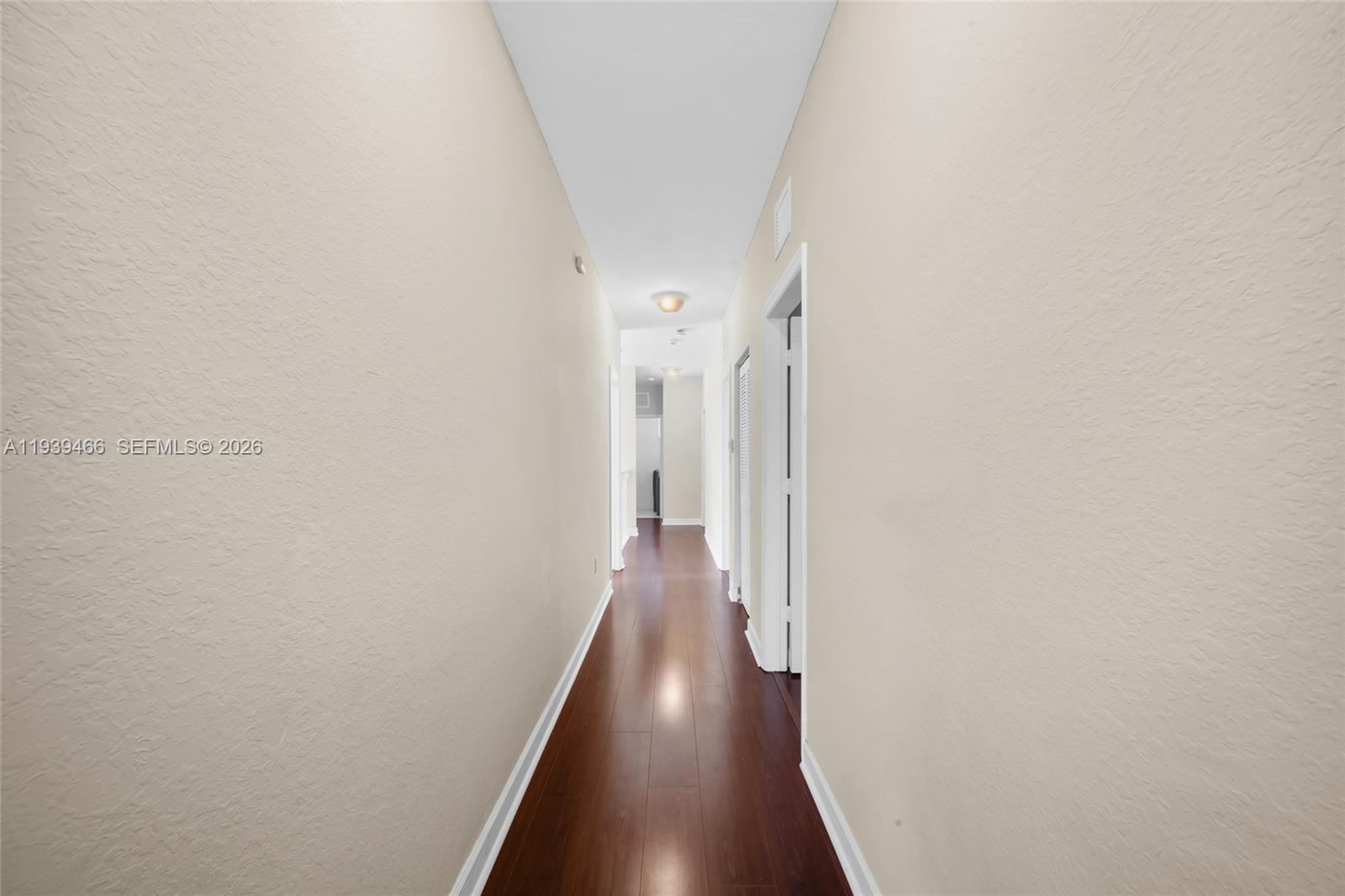 3641 Northeast 4th Street Homestead, FL 33033 - Photo 14 of 29 a view of a hallway with wooden floor