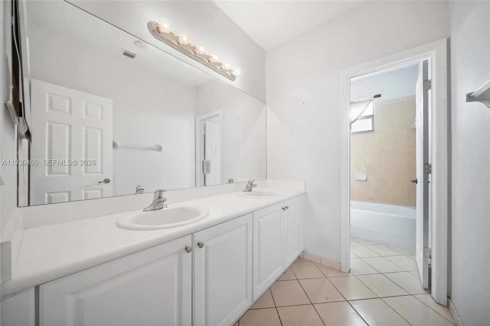 3641 Northeast 4th Street Homestead, FL 33033 - Photo 15 of 29 a bathroom with a double vanity sink mirror and