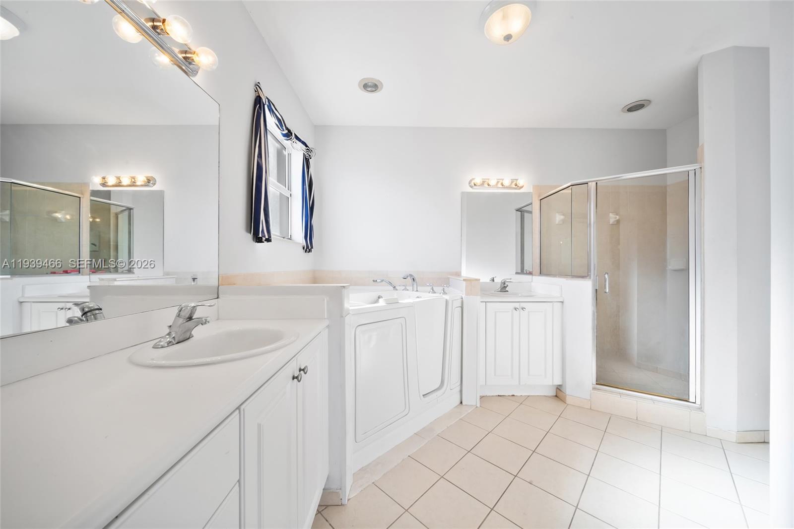 3641 Northeast 4th Street Homestead, FL 33033 - Photo 20 of 29 a bathroom with a double vanity sink mirror and
