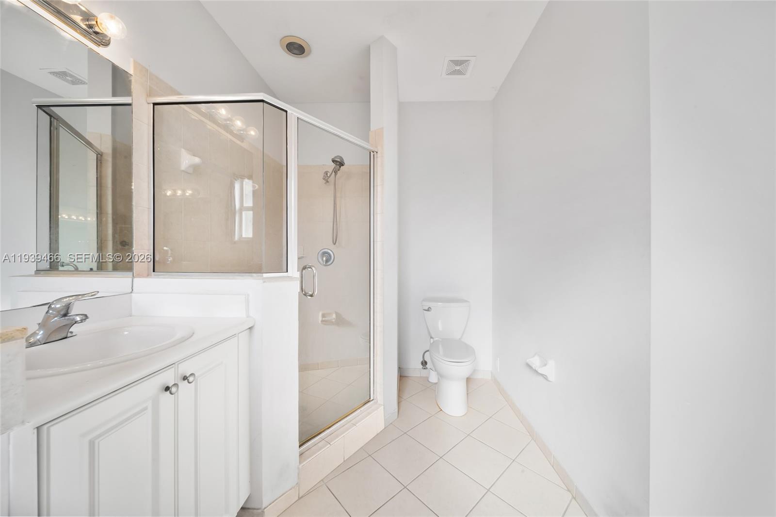 3641 Northeast 4th Street Homestead, FL 33033 - Photo 21 of 29 a bathroom with a sink mirror and a toilet