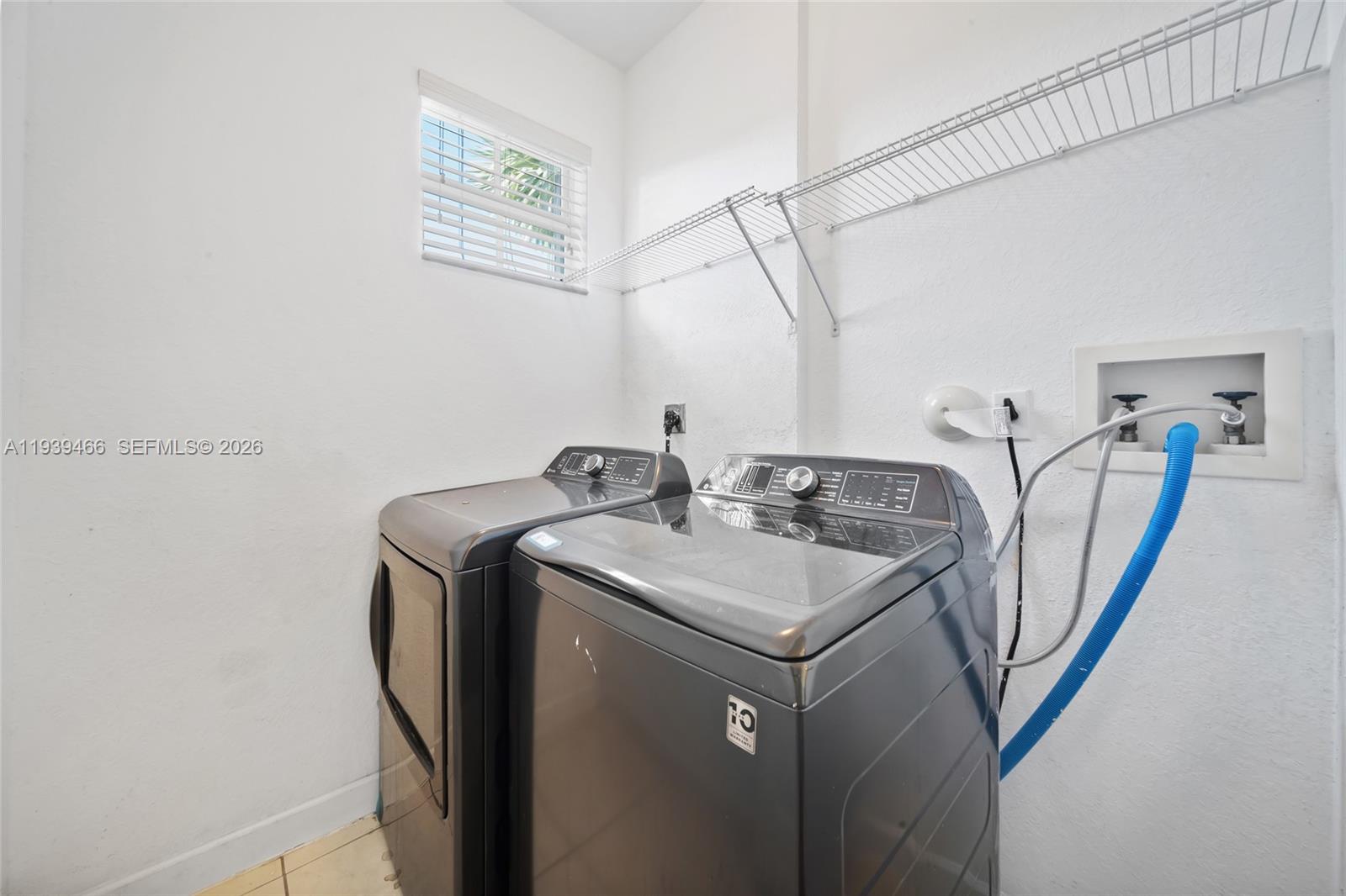 3641 Northeast 4th Street Homestead, FL 33033 - Photo 22 of 29 a utility room with dryer and washer