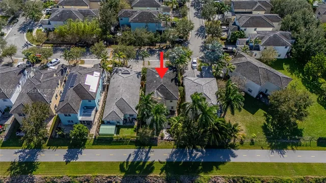 an aerial view of multiple houses with yard