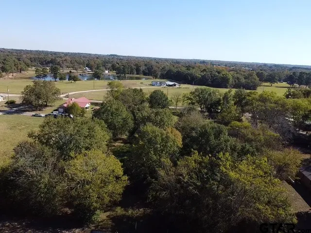 a view of a street with a yard