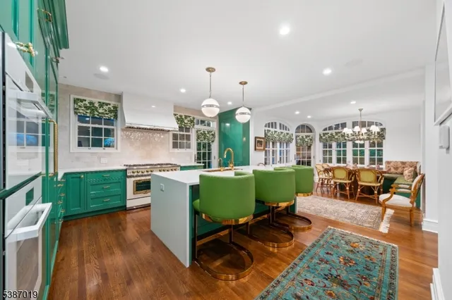 a kitchen with a sink cabinets and wooden floor