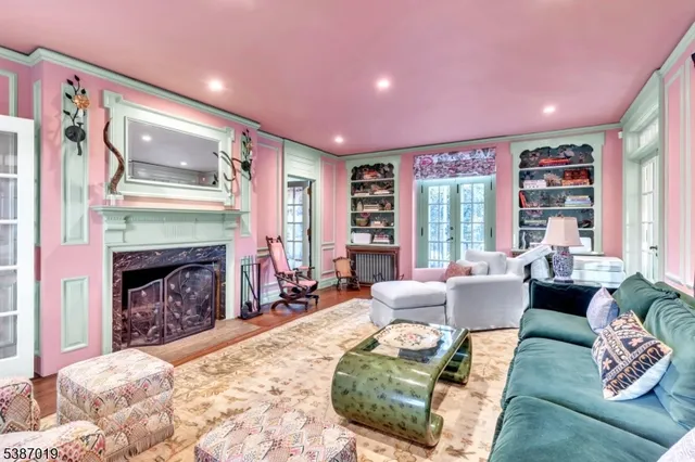 a living room with furniture rug and wooden floor