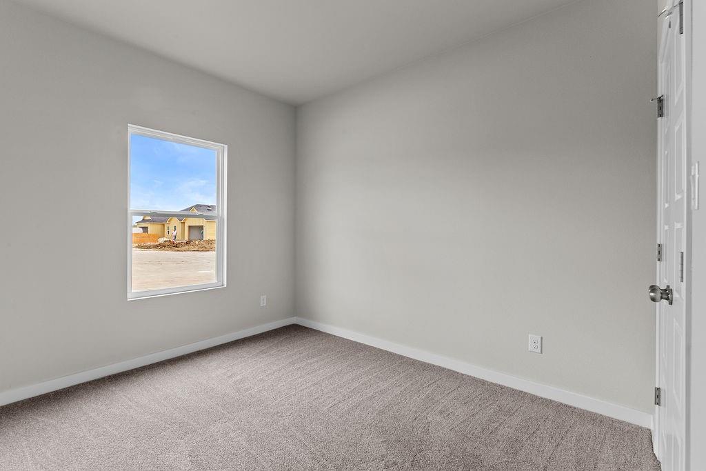 620 Alameda Road Azle, TX 76020 - Photo 11 of 27 an empty room with a window