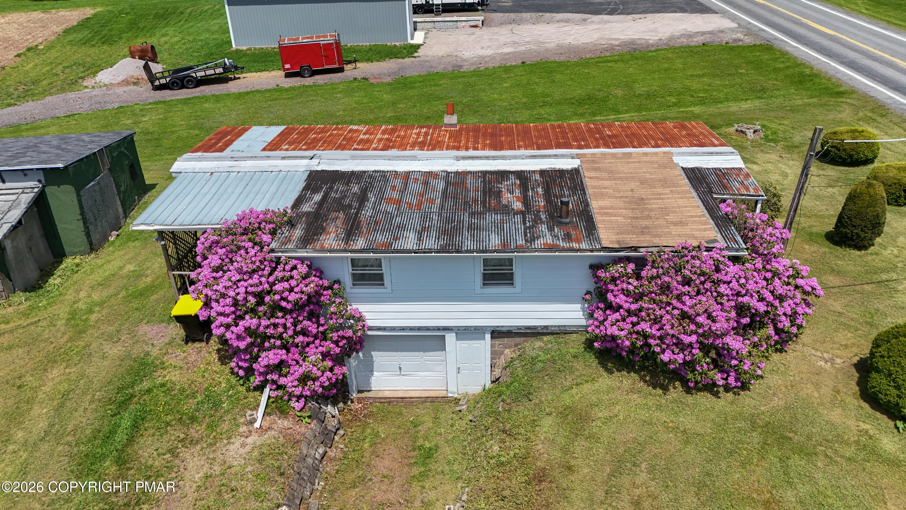 3551 Quakake Road Weatherly, PA 18255 - Photo 6 of 8 an aerial view of a house with a garden and deck