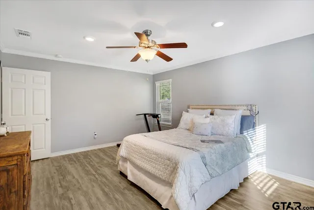 a bedroom with a bed and cabinets