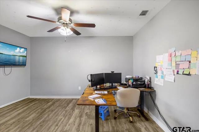 a room with furniture and wooden floor