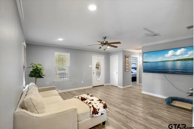a living room with furniture and a large window