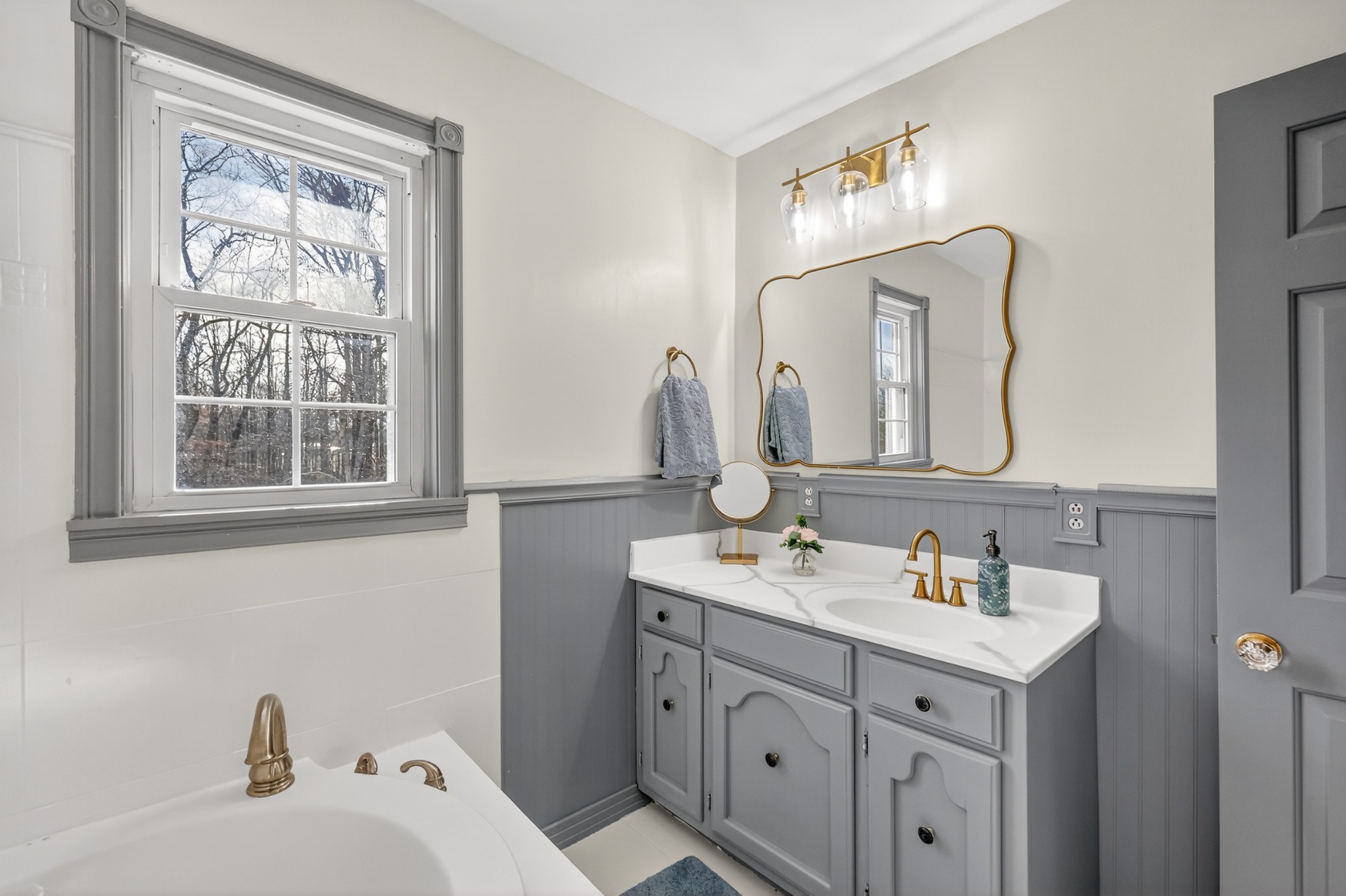 175 Dry Weakley Road Ethridge, TN 38456 - Photo 30 of 52 a bathroom with a sink and a mirror