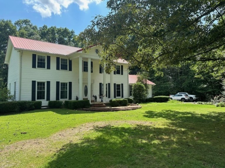 175 Dry Weakley Road Ethridge, TN 38456 - Photo 48 of 52 a front view of a house with a yard