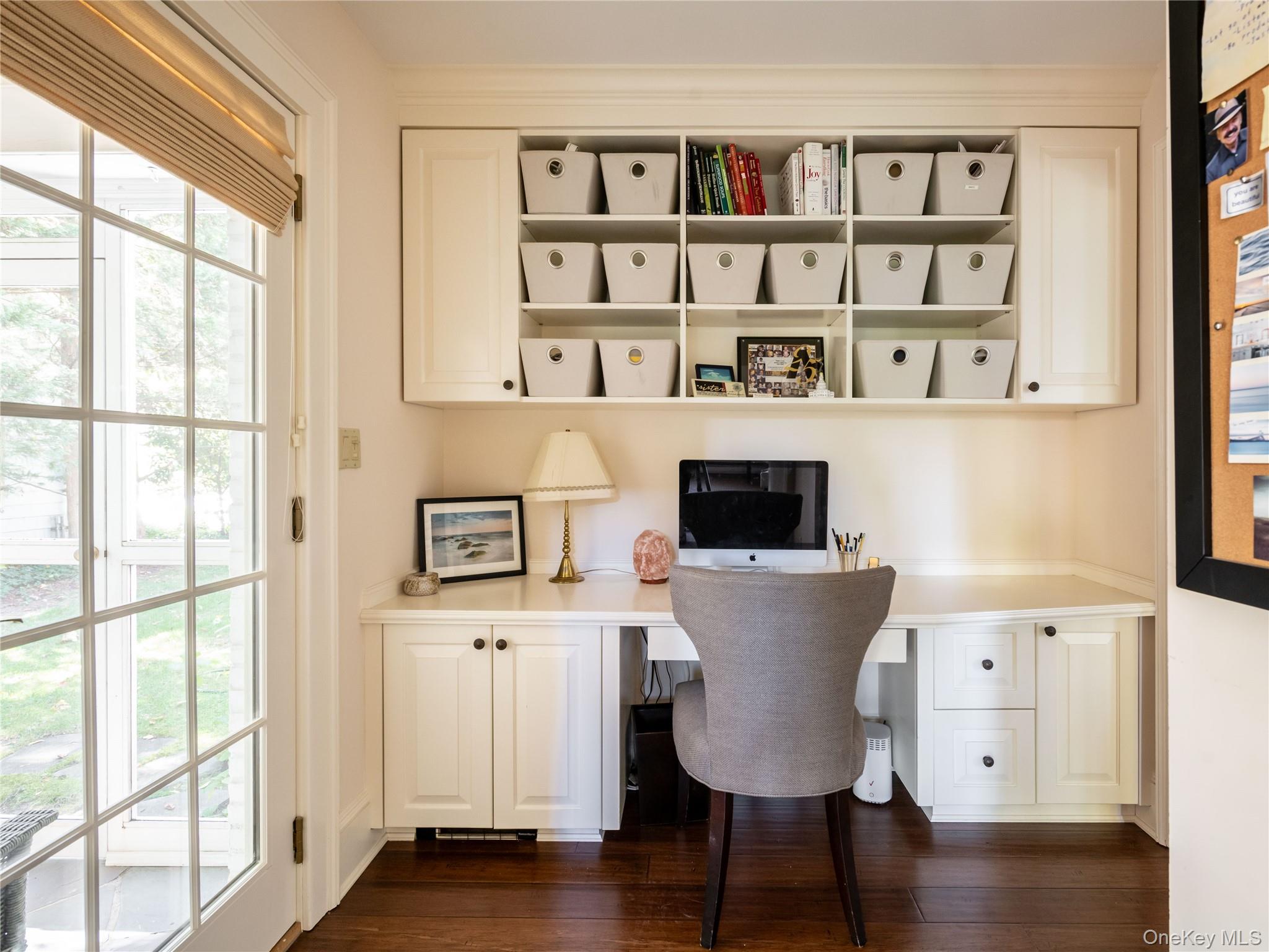 50 Eakins Road Manhasset, NY 11030 - Photo 14 of 24 a view of a living room with furniture and a book shelf