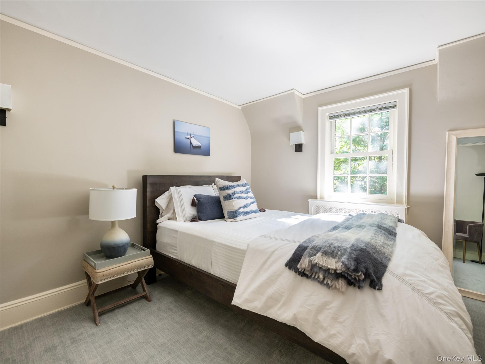 50 Eakins Road Manhasset, NY 11030 - Photo 18 of 24 a bedroom with a bed and a window