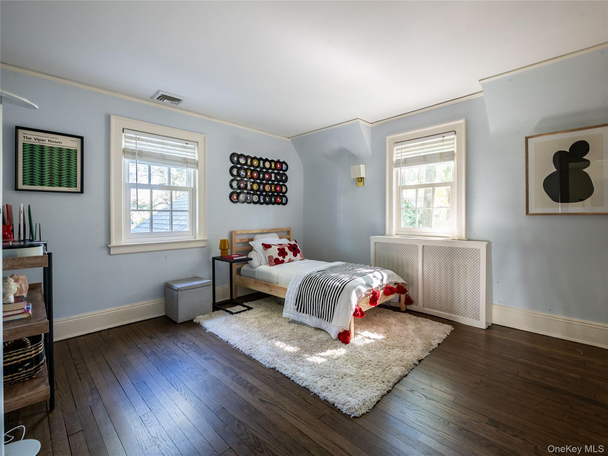50 Eakins Road Manhasset, NY 11030 - Photo 19 of 24 a bedroom with bed and a window