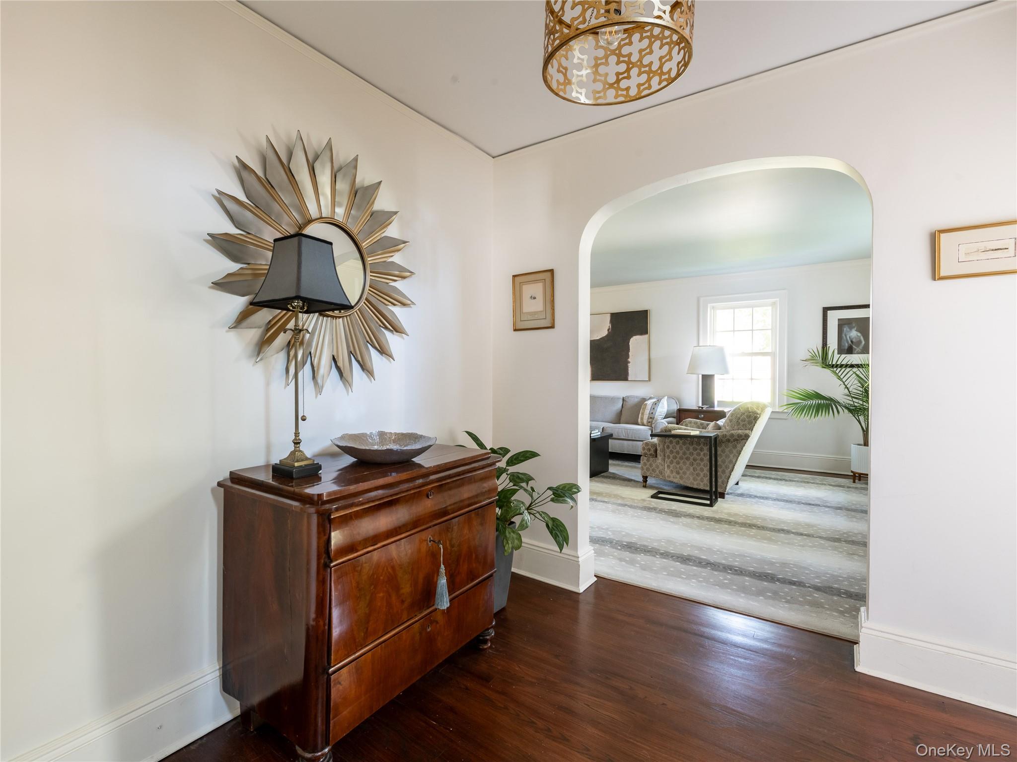 50 Eakins Road Manhasset, NY 11030 - Photo 2 of 24 a living room with furniture and a chandelier