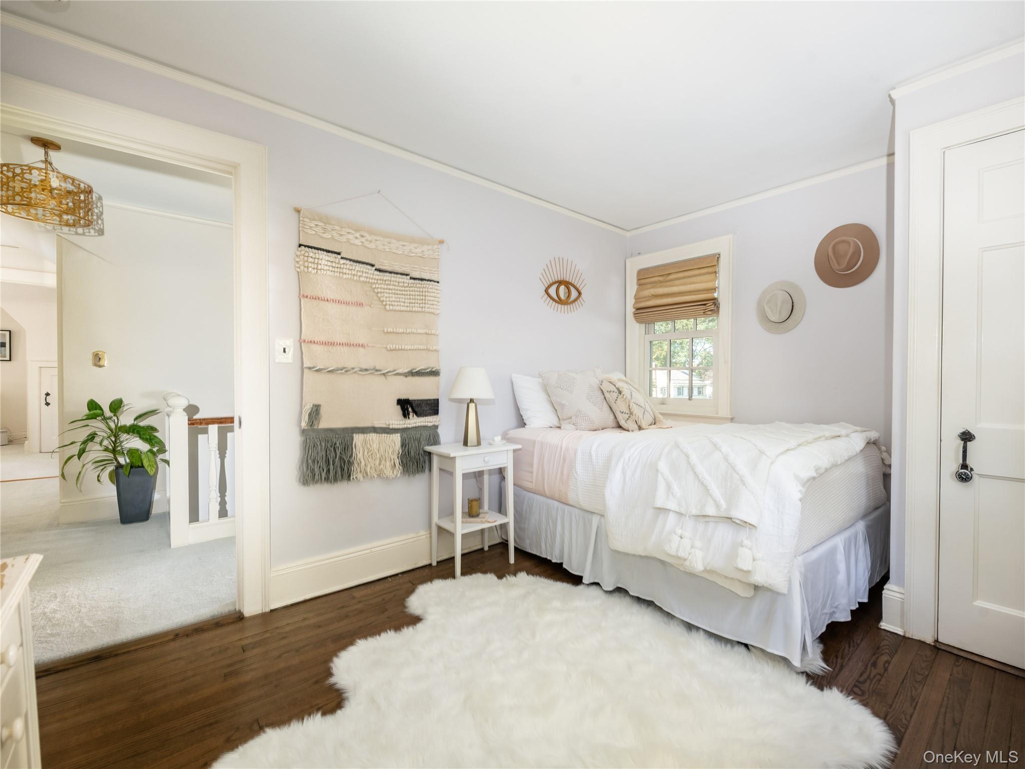 50 Eakins Road Manhasset, NY 11030 - Photo 21 of 24 a bedroom with a bed and a window