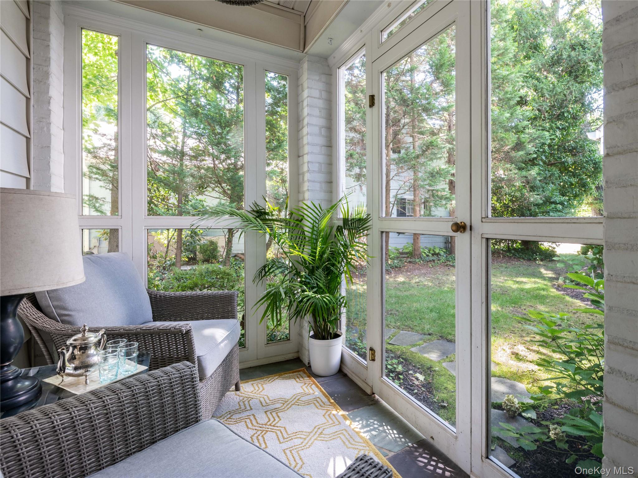 50 Eakins Road Manhasset, NY 11030 - Photo 22 of 24 a living room with furniture and a potted plant
