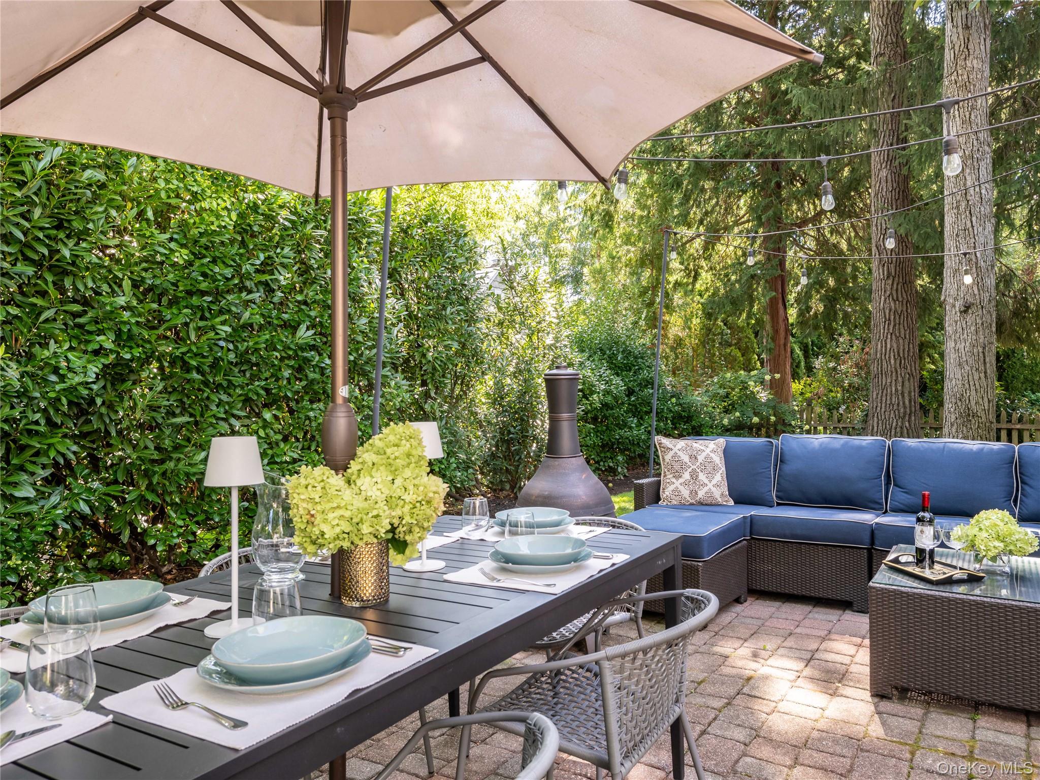 50 Eakins Road Manhasset, NY 11030 - Photo 23 of 24 a view of an outdoor dining space with a table and chairs