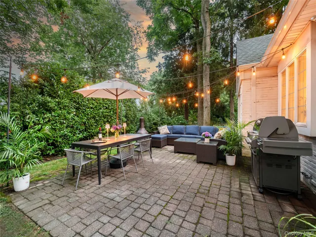 a view of a patio with furniture and a potted plants