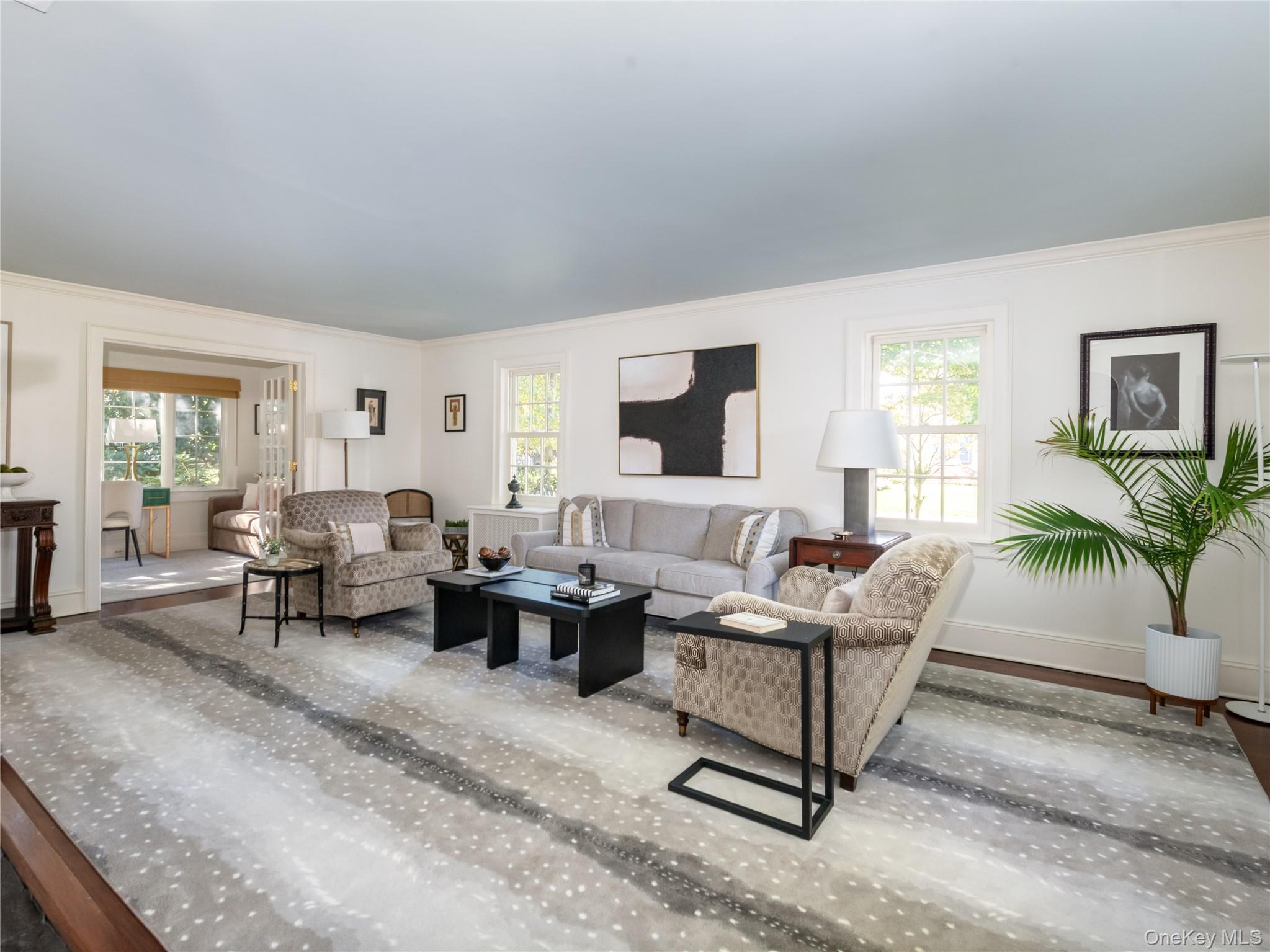 50 Eakins Road Manhasset, NY 11030 - Photo 3 of 24 a living room with furniture and a large window