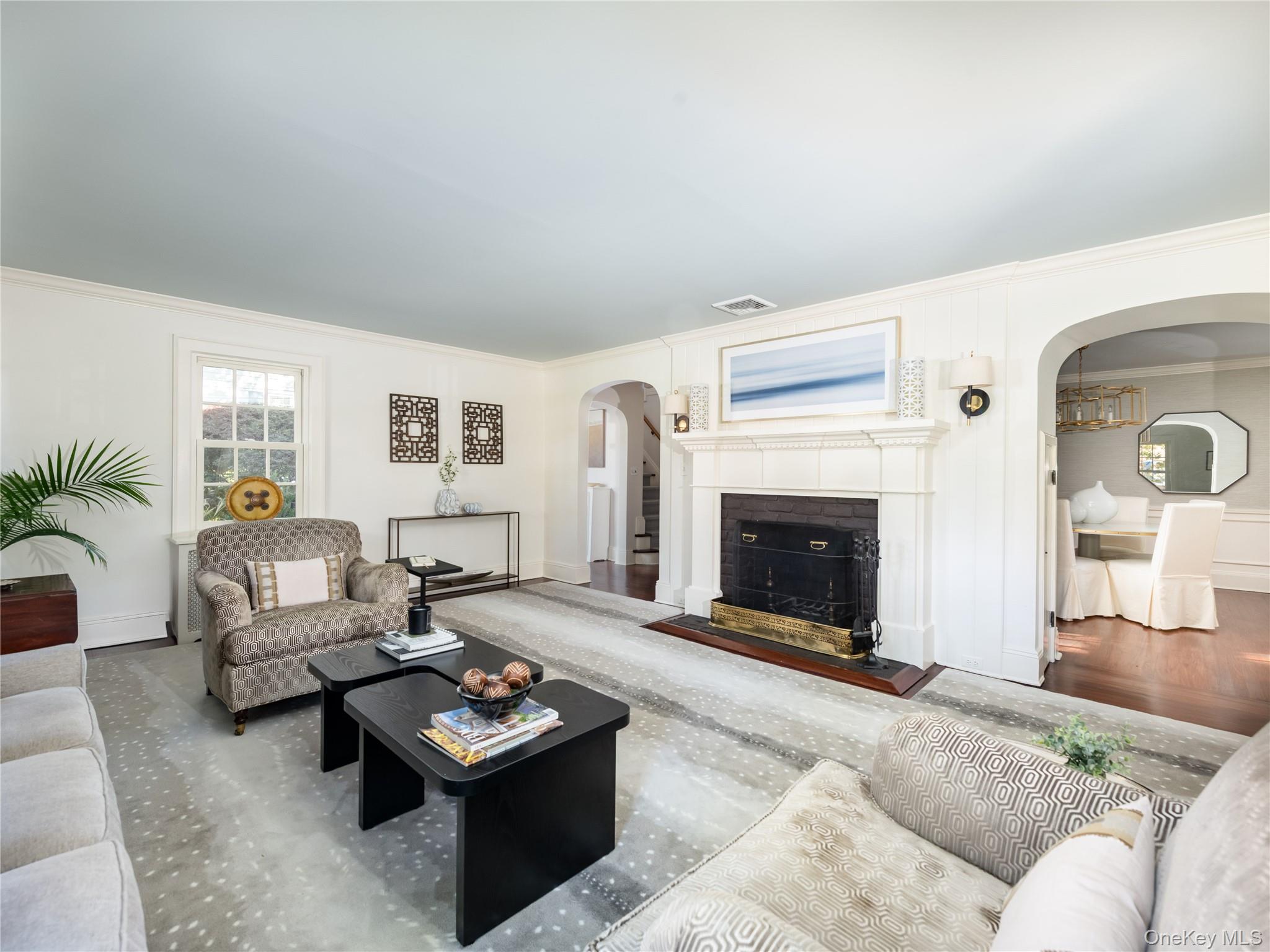 50 Eakins Road Manhasset, NY 11030 - Photo 4 of 24 a living room with furniture and a fireplace
