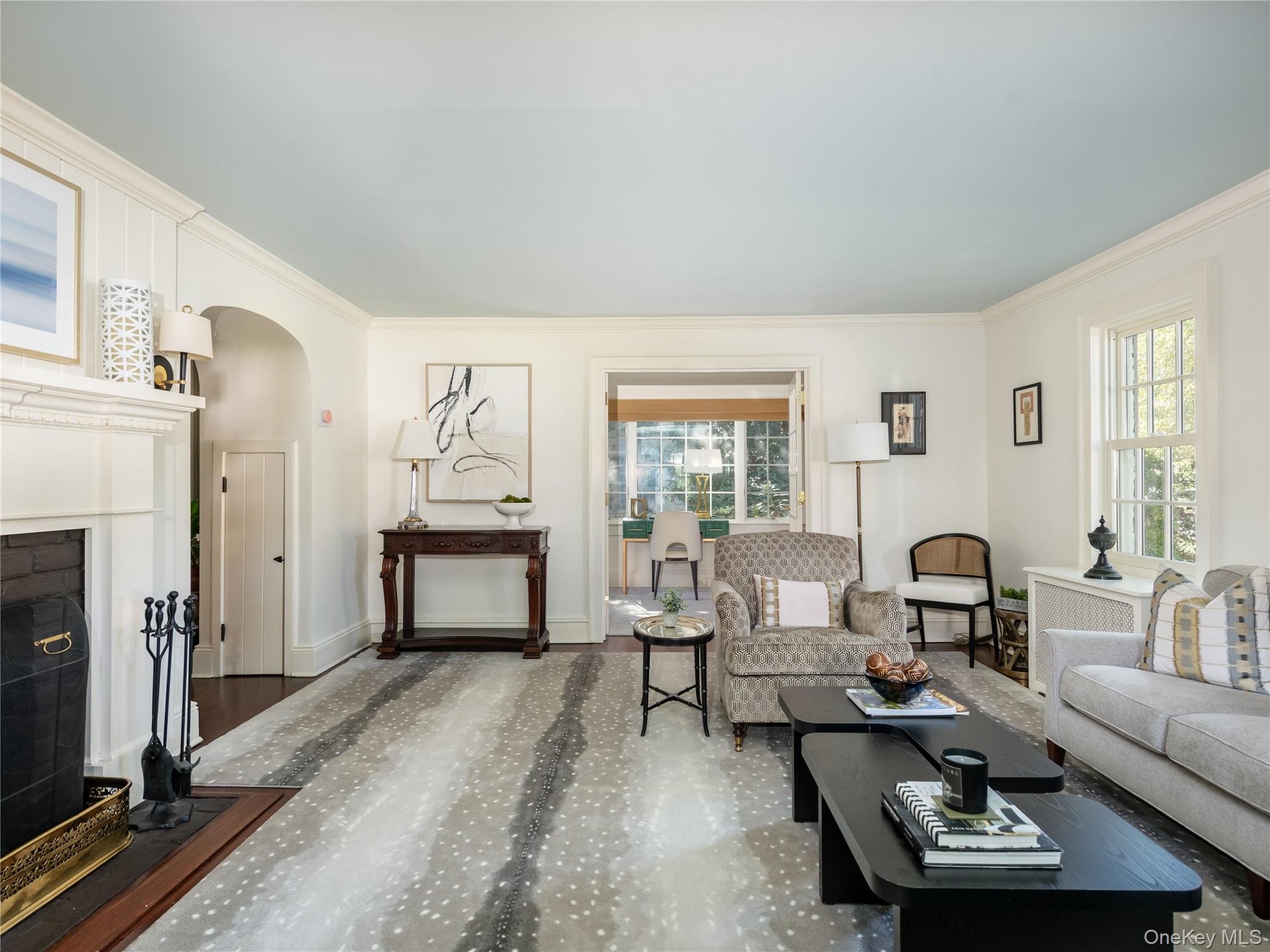 50 Eakins Road Manhasset, NY 11030 - Photo 5 of 24 a living room with furniture a fireplace and wooden floor