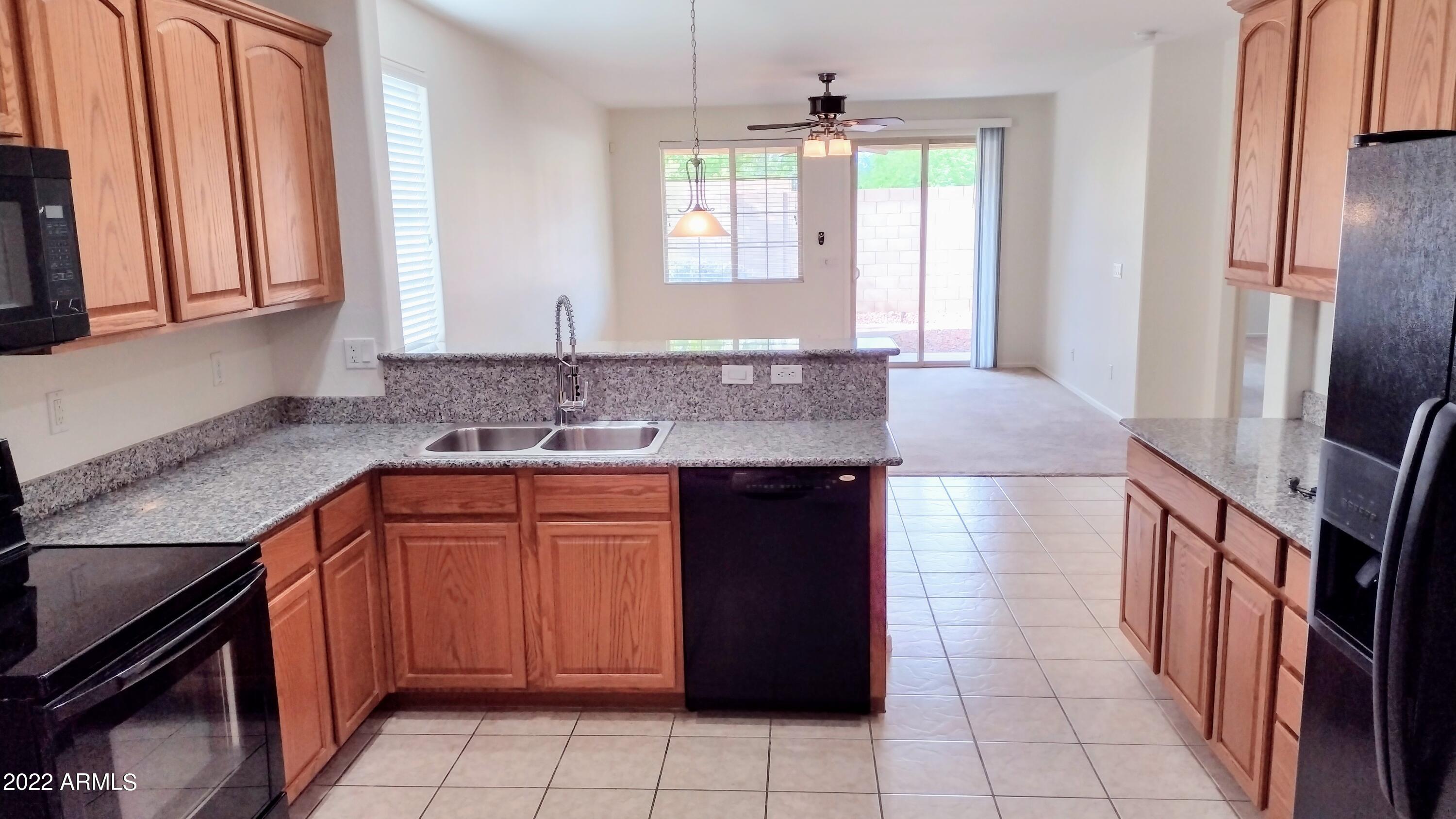 17440 West Bajada Road Surprise, AZ 85387 - Photo 7 of 31 Kitchen & Family room
