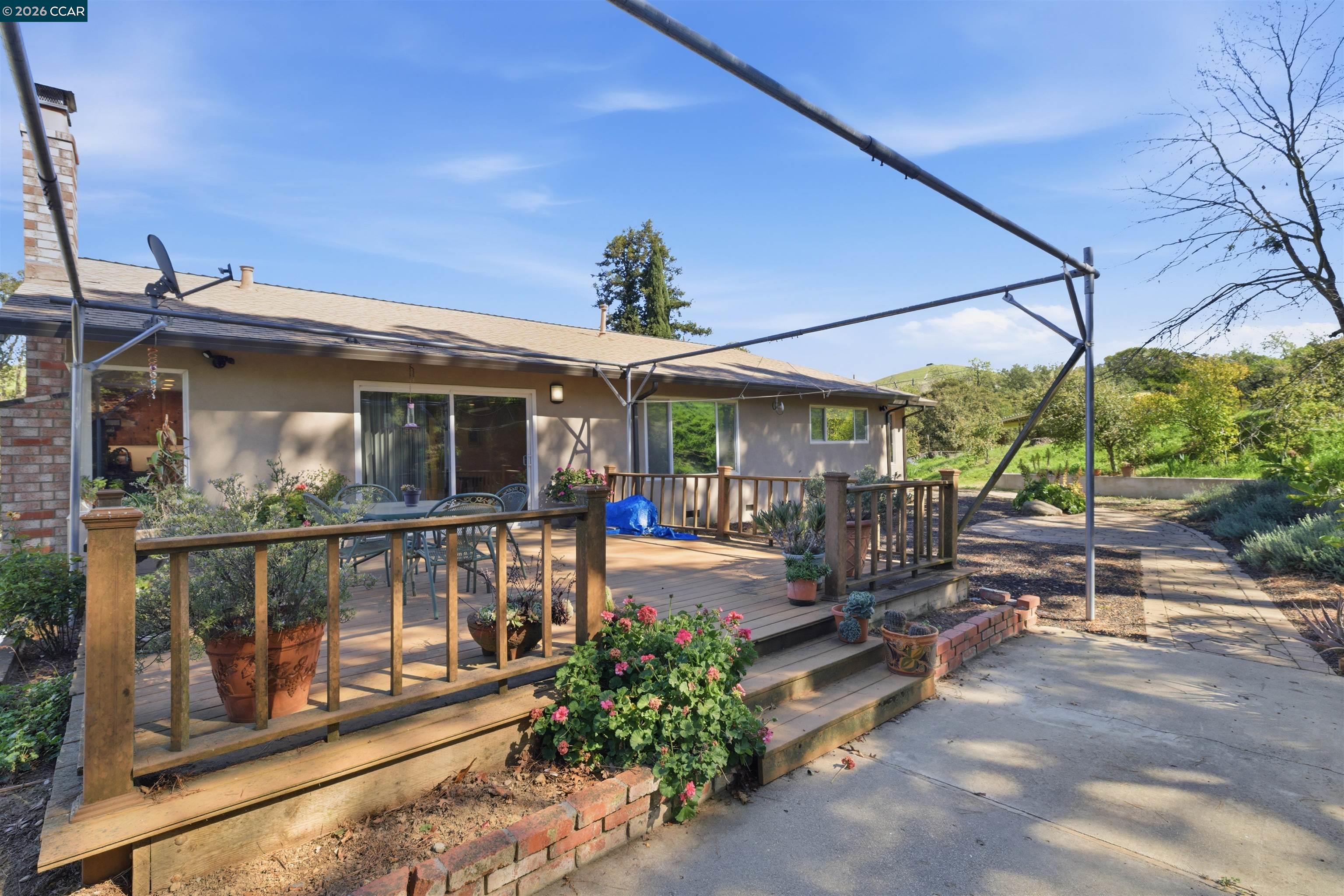 9530 Morgan Territory Road Livermore, CA 94551 - Photo 5 of 55 a view of a house with sitting area and garden