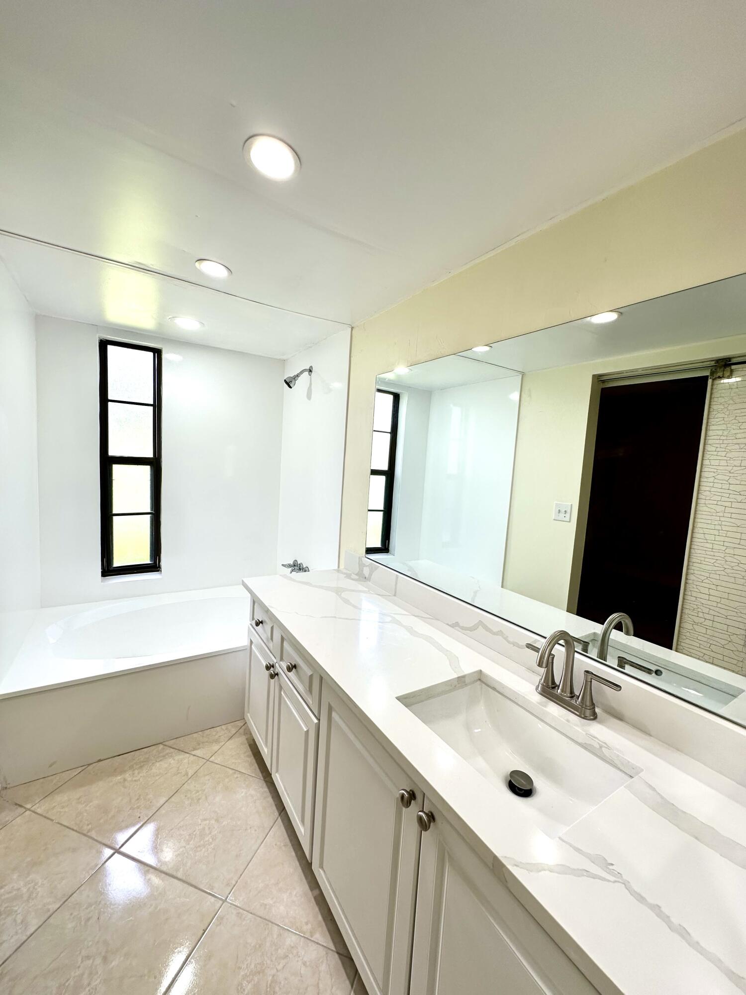 9440 Southwest 8th Street, Unit 109 Boca Raton, FL 33428 - Photo 5 of 14 Primary Bathroom