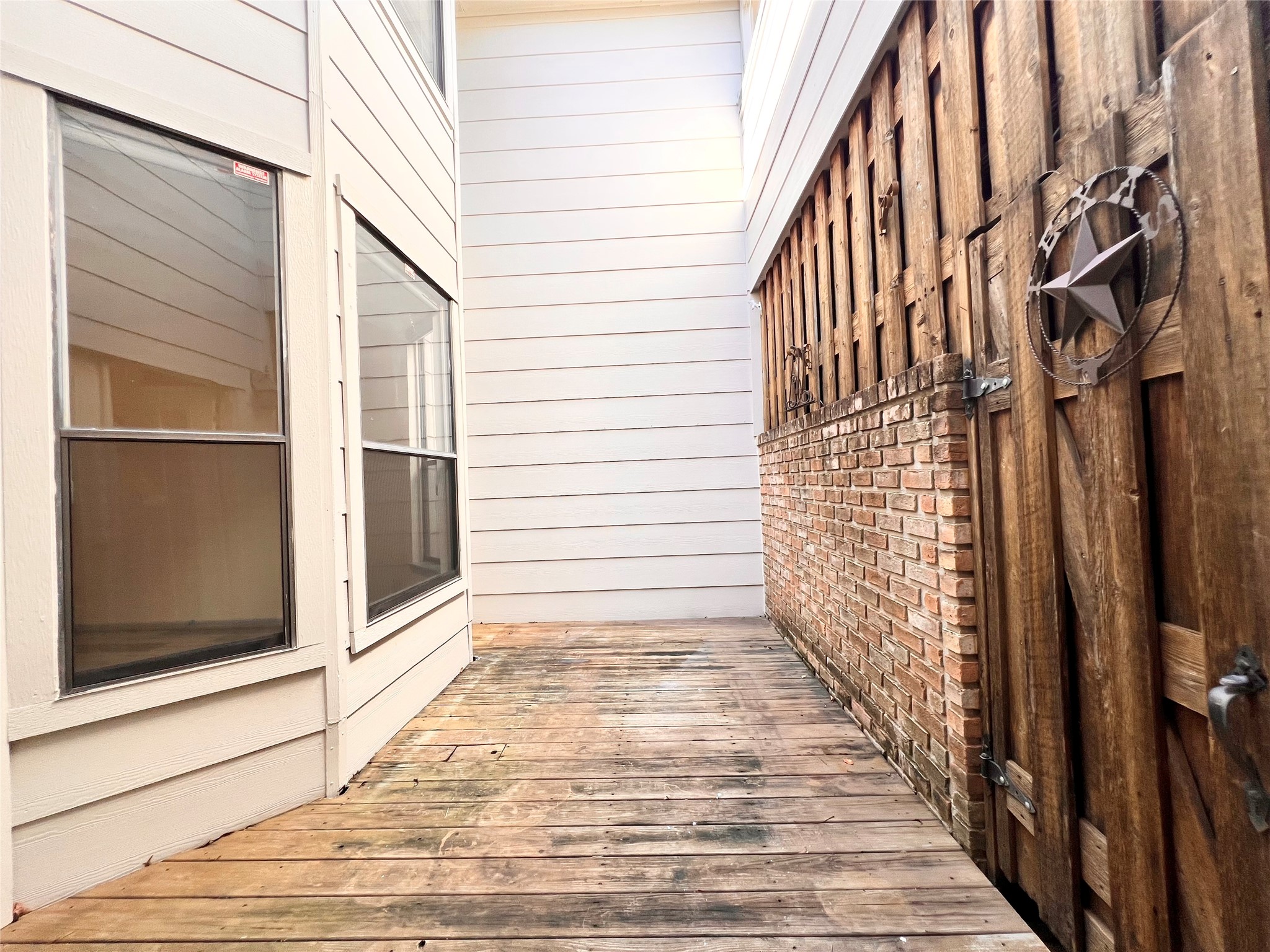727 Bunker Hill Road, Unit 92 Houston, TX 77024 - Photo 17 of 36 a view of a house with a door and wooden floor