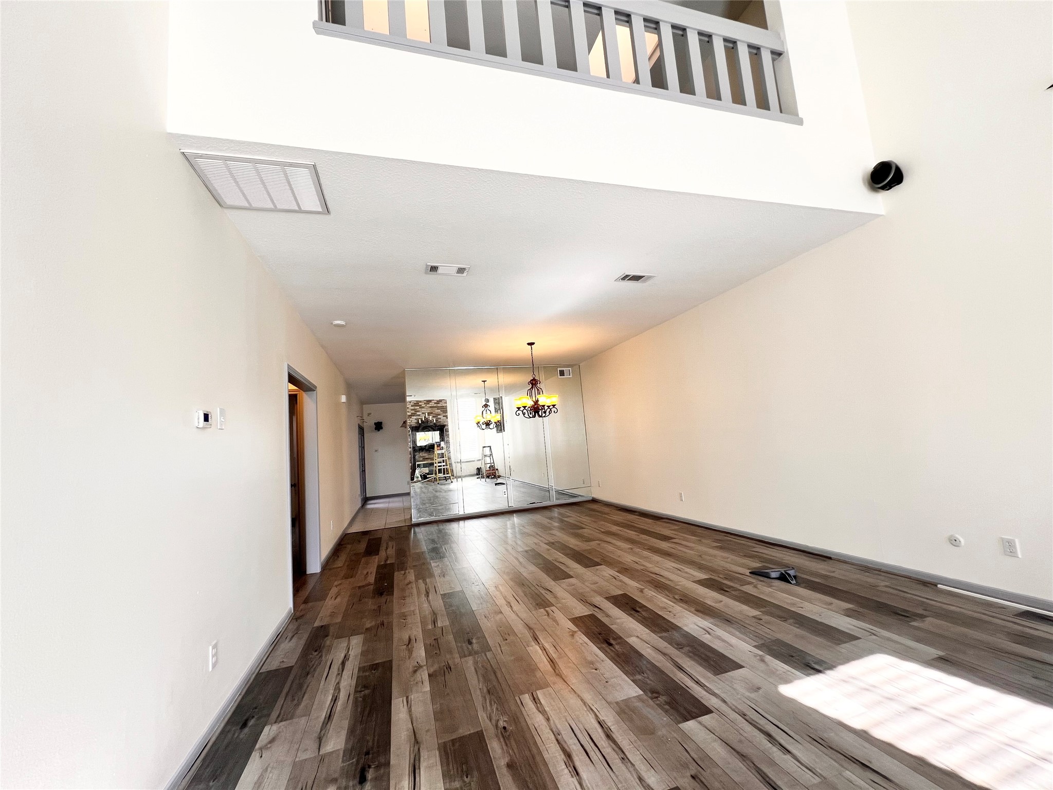 727 Bunker Hill Road, Unit 92 Houston, TX 77024 - Photo 2 of 36 a view of a hallway with wooden floor