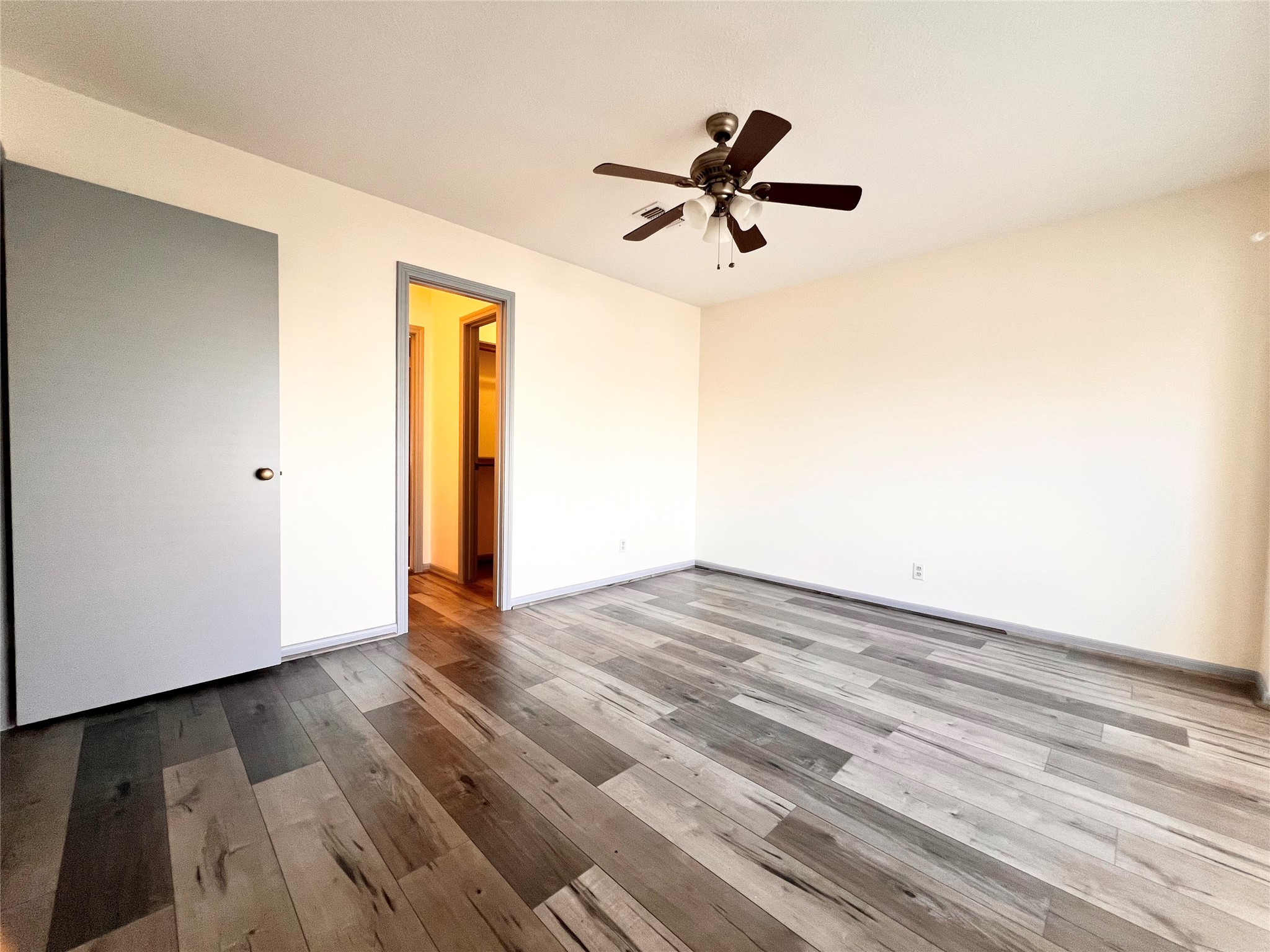 727 Bunker Hill Road, Unit 92 Houston, TX 77024 - Photo 31 of 36 a view of empty room with wooden floor and fan