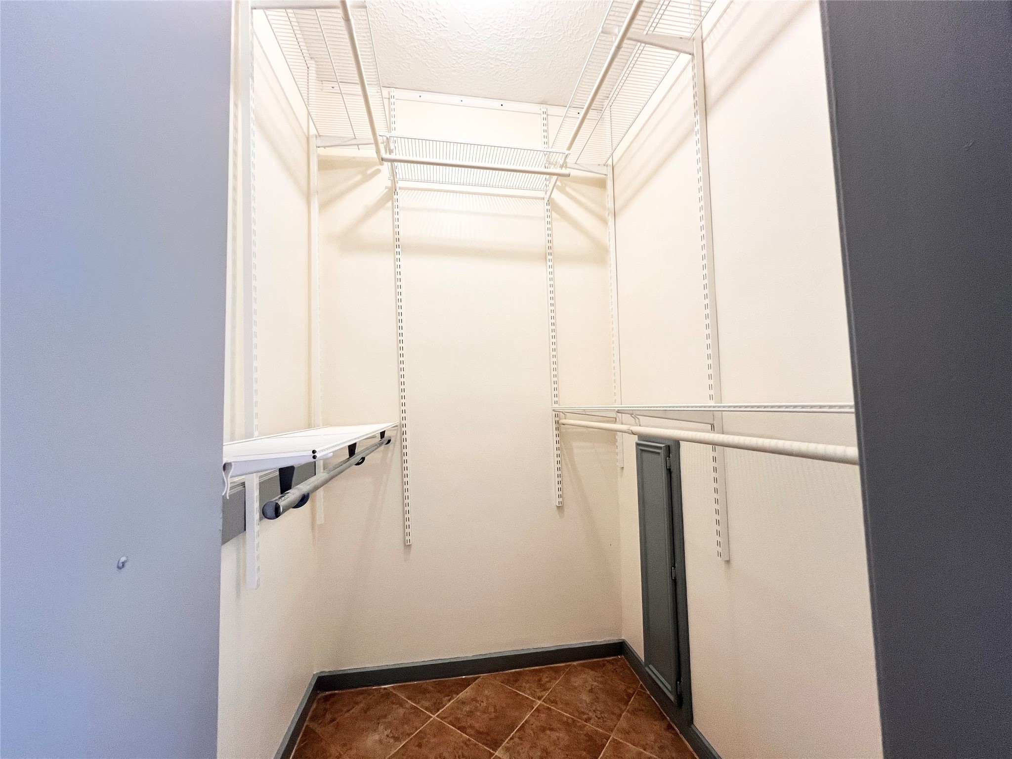 727 Bunker Hill Road, Unit 92 Houston, TX 77024 - Photo 33 of 36 a view of walk in closet with empty racks