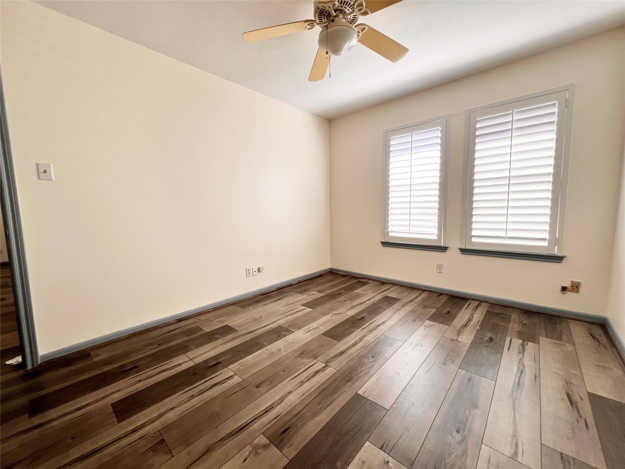 727 Bunker Hill Road, Unit 92 Houston, TX 77024 - Photo 36 of 36 a view of a room with wooden floor and fan