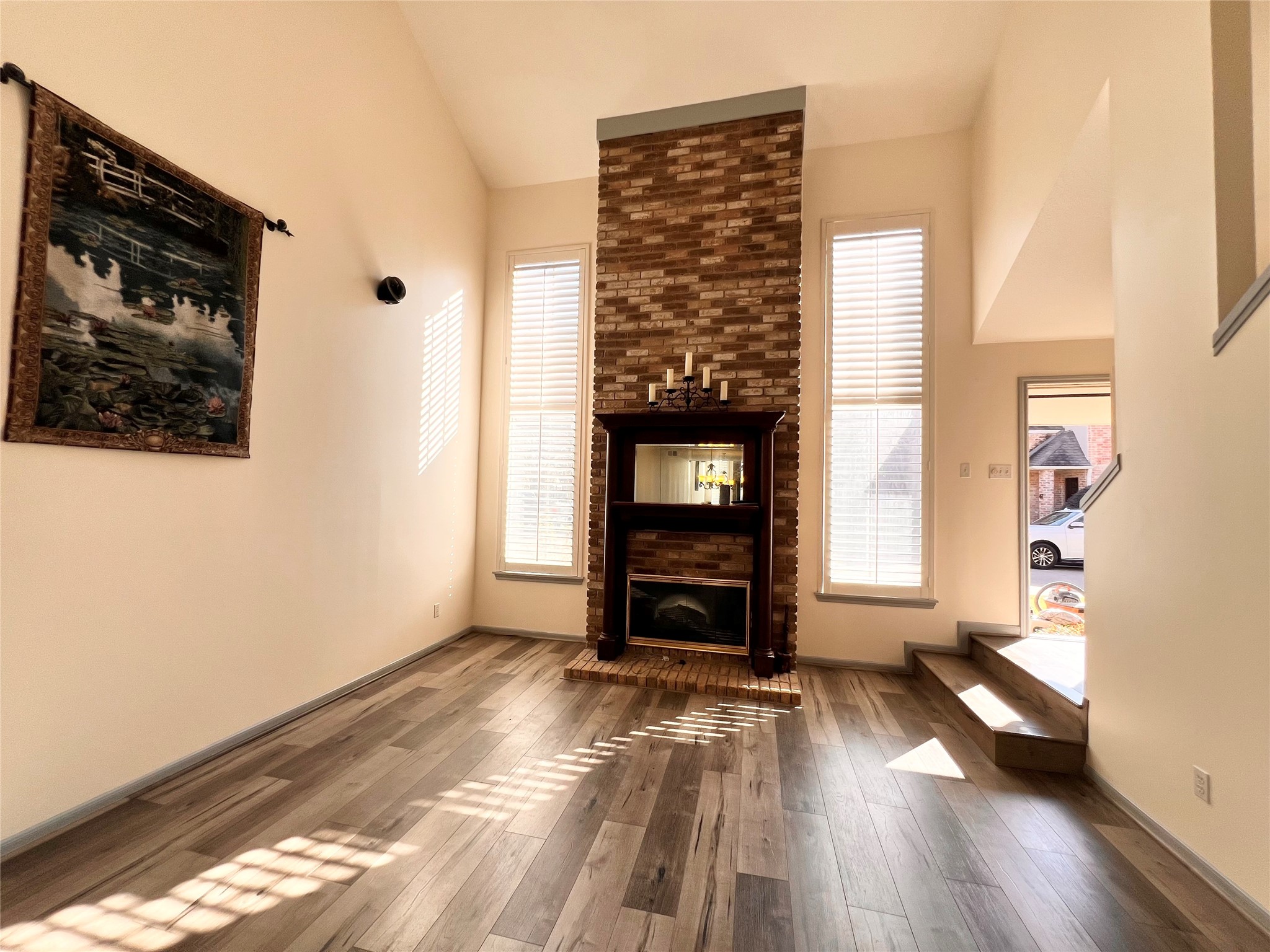 727 Bunker Hill Road, Unit 92 Houston, TX 77024 - Photo 4 of 36 a view of empty room with wooden floor and fan