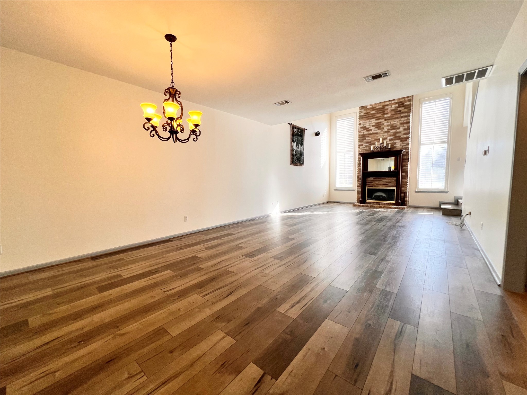 727 Bunker Hill Road, Unit 92 Houston, TX 77024 - Photo 5 of 36 a view of empty room with wooden floor