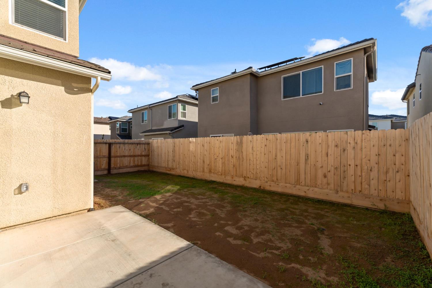1116 Elevations Way West Madera, CA 93636 - Photo 27 of 35 a view of a house with a backyard