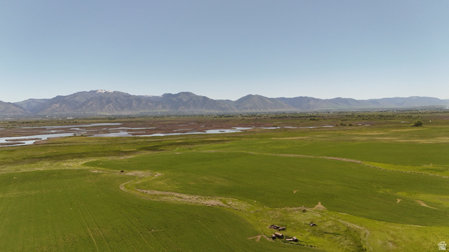 320 South 5400 West Logan, UT 84321 - Photo 32 of 42 Expansive green fields with distant mountains and a body of water