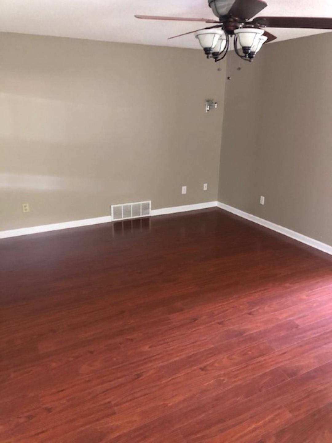 1386 Milestone Circle Collierville, TN 38017 - Photo 7 of 16 Spare room featuring baseboards and dark wood-style flooring