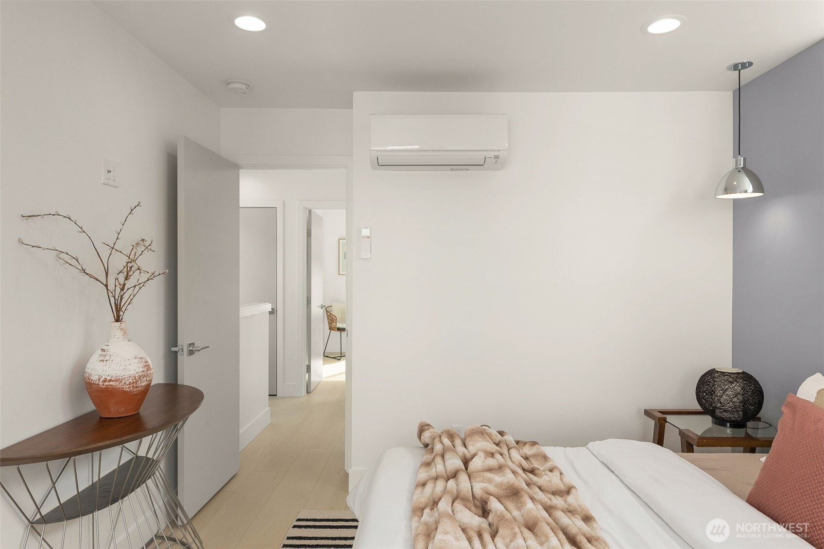 911 North 98th Street, Unit A Seattle, WA 98103 - Photo 19 of 26 a bedroom with a bed and a table in it