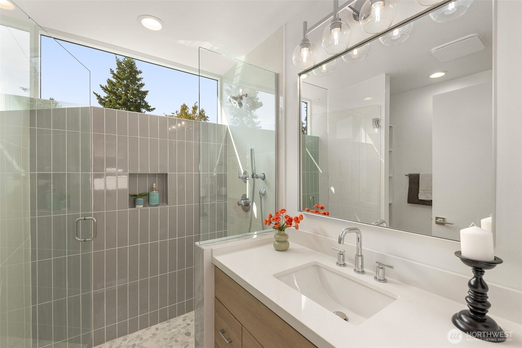 911 North 98th Street, Unit A Seattle, WA 98103 - Photo 20 of 26 a bathroom with a sink shower and a mirror
